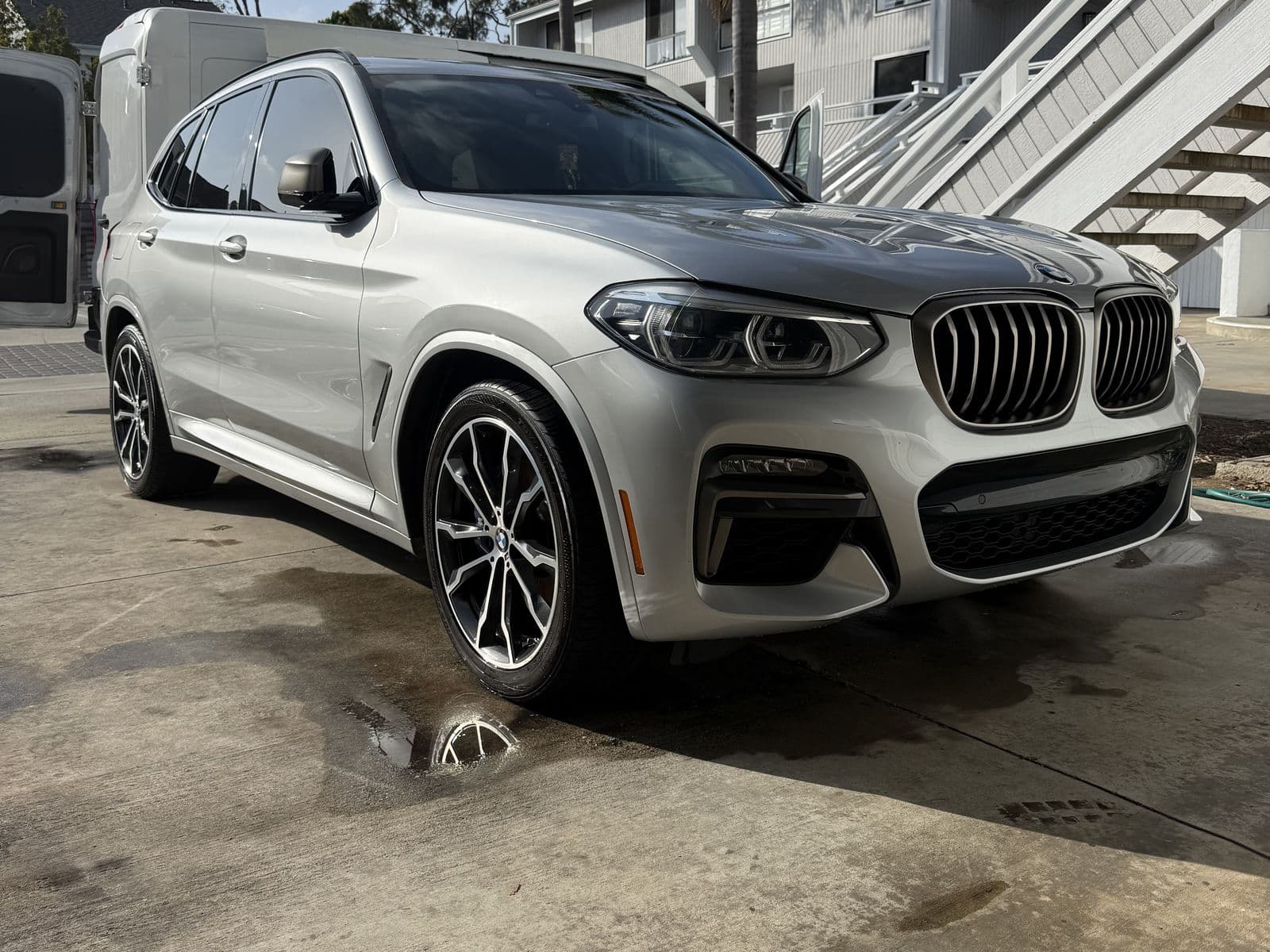 Detailed BMW X3 exterior, wet from a fresh hand wash